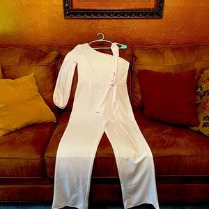 Looking for a classy white jumpsuit!! One sleeve never been worn..